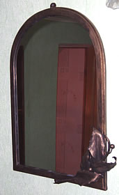 A forged frame of a mirror 