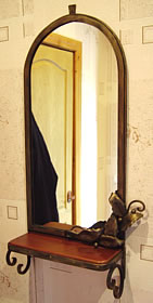 A forged frame of a mirror 